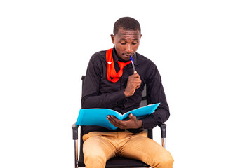 young business man sitting and thinking about what to write in the document.