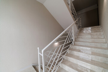 white metal railings bent style on the stairs in the house