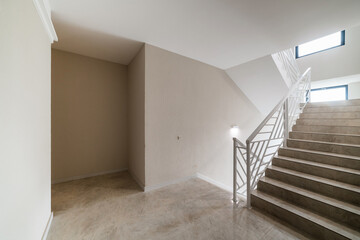 new clean white light corridor with stairs in the house