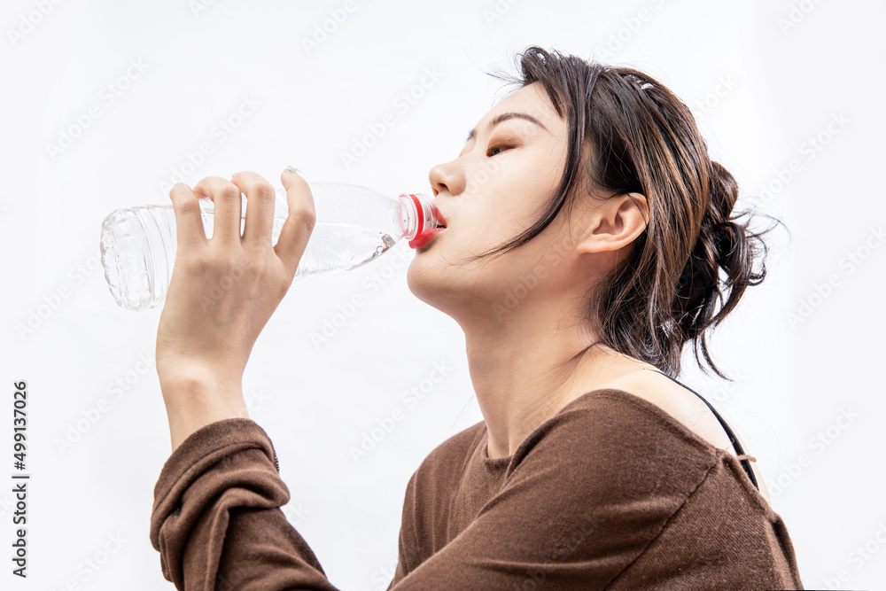 Wall mural girls drink plenty of water to replenish body fluids after exercise