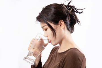 Girls drink plenty of water to replenish body fluids after exercise