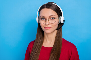 Photo of smart millennial lady wear headphones spectacles burgundy sweater isolated on blue color...