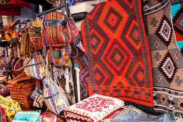 Colorful Red Carpets in Oldest Bazaar Egyptian Bazaar located name is Mısır Çarşısı also knowns as Spice Bazaar Fatih İstanbul, Turkey  on 29 March 2022