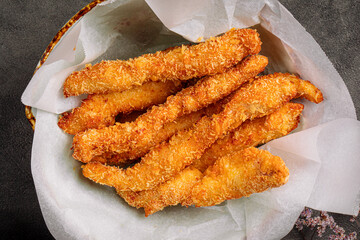 Closeup on deep fried chicken fillet stripes