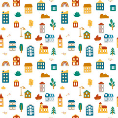 Beautiful colorful seamless pattern with cartoon houses and adds elements: plants, hills, stones, streetlight, rainbow. Cute vector illustration for fabric, textile, background, wallpaper.
