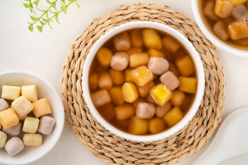 Delicious sweet taro ball soup in a white bowl for serving.
