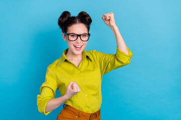 Photo of delighted startup owner lady win important partnership contract fist up isolated blue color background