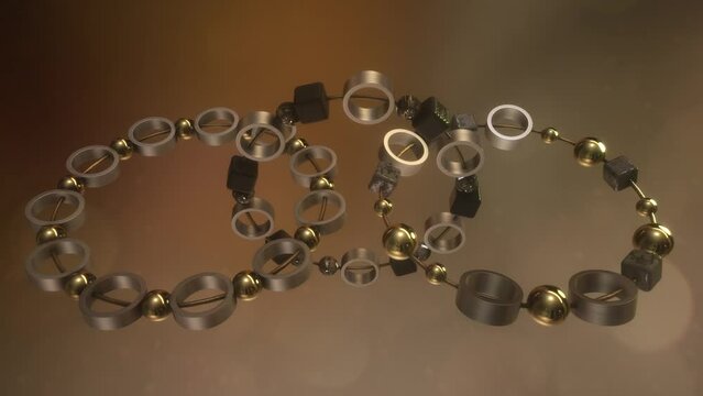 Animazione 3D con anelli con sfere e cubetti legati da un filo con colore oro ed argento