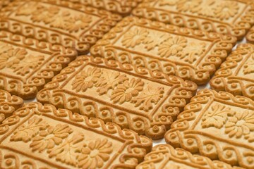 Sweet cookie texture with beautiful pattern. Food background. Selective focus.