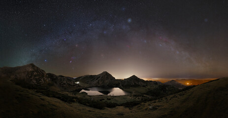 Winter night at Lake Enol with the arc of the winter milky way