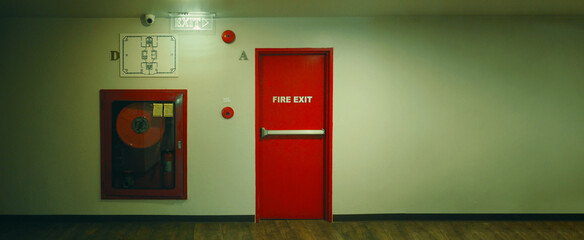 Fire exit door. Fire exit emergency door red color metal material with alarm and emergency light...