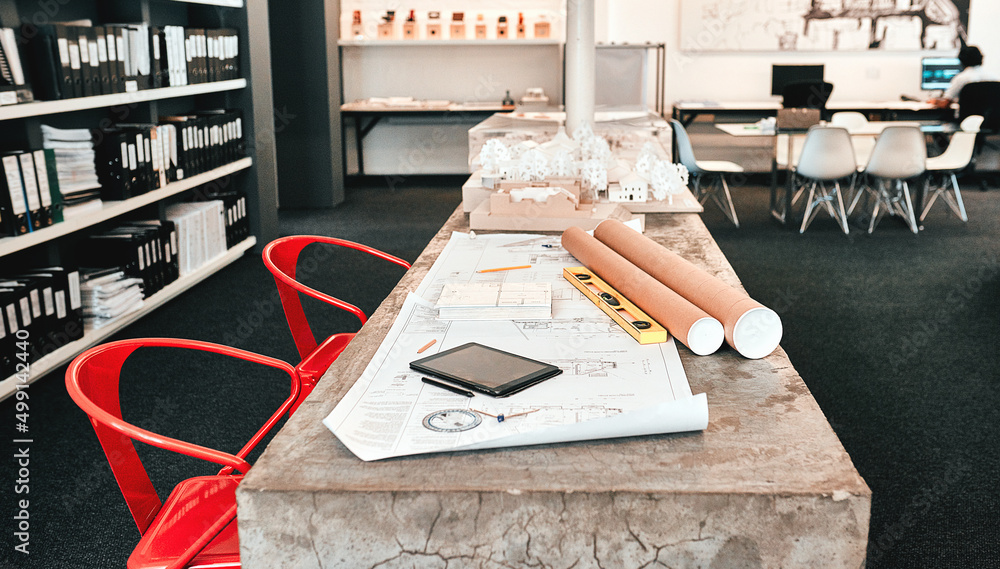 Aufkleber the designers corner. still life shot of an architects blueprints placed on a desk in a modern offic