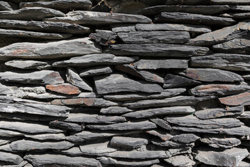Grey bricks slate texture background, slate stone wall texture . Copy space