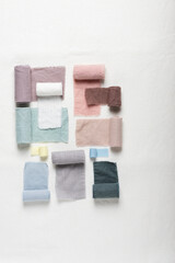 Different colors fabric samples on the white table