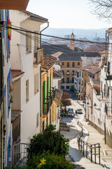 Fototapeta na wymiar Street scene with stairs in Granada, Spain 