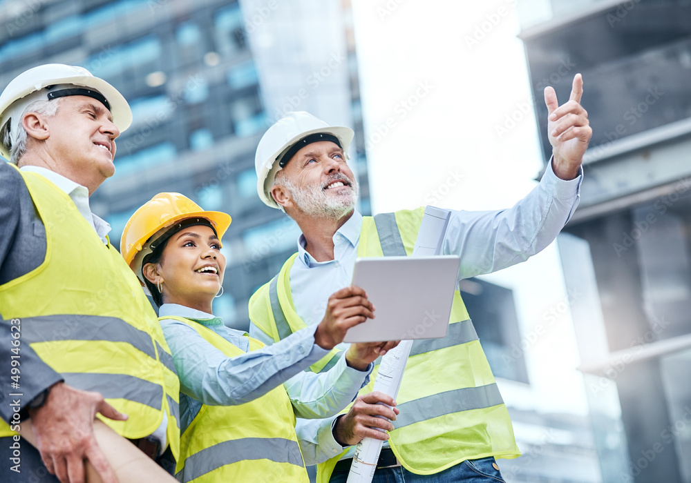 Poster Managing a complex project together. Shot of a group of businesspeople using a digital tablet while working at a construction site.