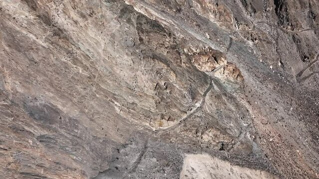 Dangerous road to Fairy Meadows and Nanga Parbat in Northern Pakistan, aerial.  Karakoram Highway through Khunjerab National Park in Hunza Valley, Gilgit-Baltistan, Pakistan