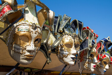 Souvenir Venetian masks close-up on a sunny day