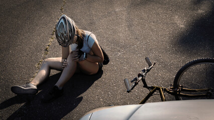 Girl who rode bicycle, hit car and waiting for medical assistance