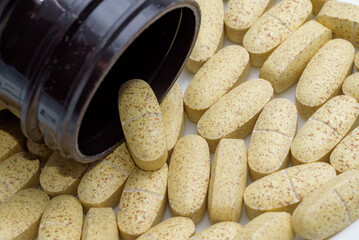 Oval shaped supplement tablets (Yellow color)