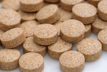 Supplement round tablets (skin color)