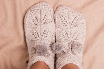 Handmade knitted socks on the legs