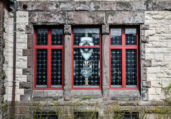 Fototapeta na wymiar Old historic window in vintage urban building