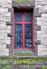 Fototapeta na wymiar Old historic window in vintage urban building