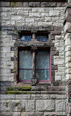 Old historic window in vintage urban building