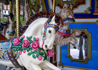 Vintage carousel merry-go-round ride in the city amusement park