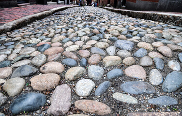 Empty historic old cobblestone alleyway street 