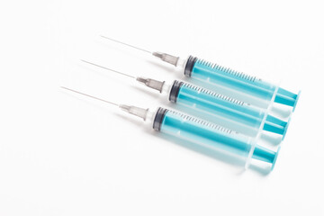Medical syringe on a white background. A syringe for injection. The concept of health and beauty