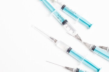 Fototapeta premium Medical syringe on a white background. A syringe for injection. The concept of health and beauty