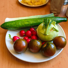 White plate with various vegetables, healthy eating concept
