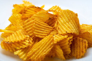 Heap of chips in blur. Chips are not sharp. Chips with bokeh effect on the edges