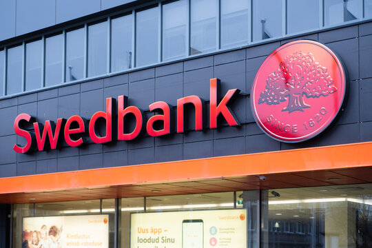 Tallinn, Estonia - 04.15.2022: Swedbank logo on Tallinn head office. Swedbank group offers retail banking, asset management, other financial services. Traded at Nasdaq Stockholm stock exchange as SWED
