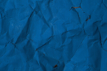 Crumpled blue painted paper, texture