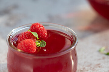 Raspberry jelly in glass. Jelly. Jar of jelly.