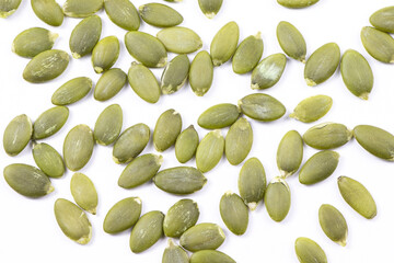 Pumpkin seeds macro view isolated on a white background. Healthy raw food