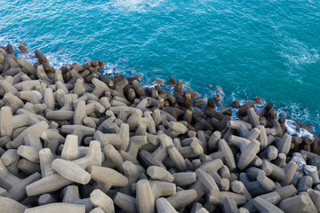 Obraz premium Top down view of concrete wave breaker