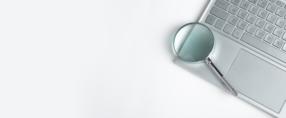 Banner with magnifying glass on laptop. Information search concept. Digital information analysis....