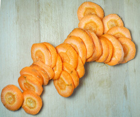 Sliced ​​carrots on a cutting board. Carrot slices. Vegetarian food. Fresh vegetables on the table. cooking dinner