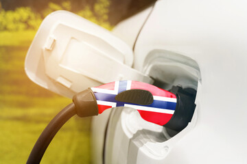 Charging electric vehicles with an electric cable with the image of the Norwegian flag