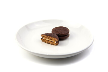Chocolate cookies on white dish