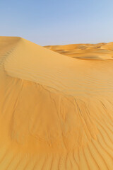 Fototapeta na wymiar Dunes and colored sands of the Rub al-Khali desert