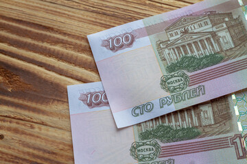 Russian banknotes of one hundred rubles are on the table