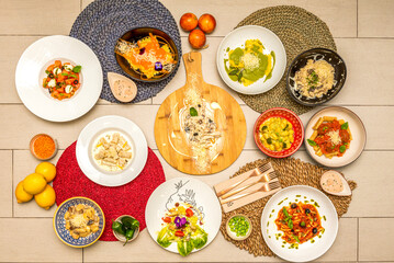 Italian food recipes with lemons, rocket salad, spaghetti bolognese, pesto gnocchi, spaghetti carbonaras, broccoli, tagliatelle and basil