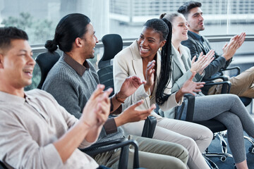 Clap for others while you wait for your turn. Shot of a group of businesspeople having a meeting in a boardroom at work.