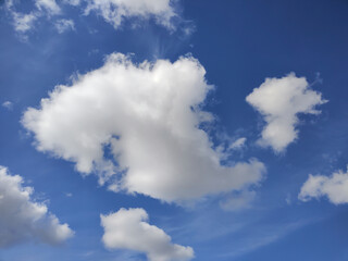 Obraz na płótnie Canvas Fluffy cloud texture from a perfect cloudy blue sky