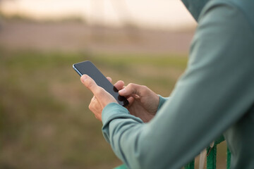 Man using smart phone outdoors